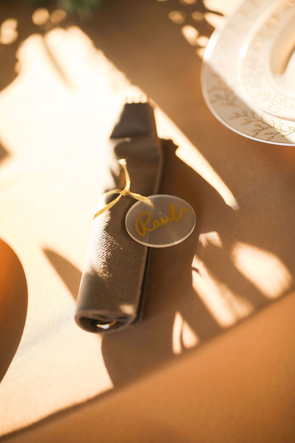 A napkin with a name tag on it is sitting on a table.