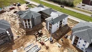 An aerial view of a building under construction.