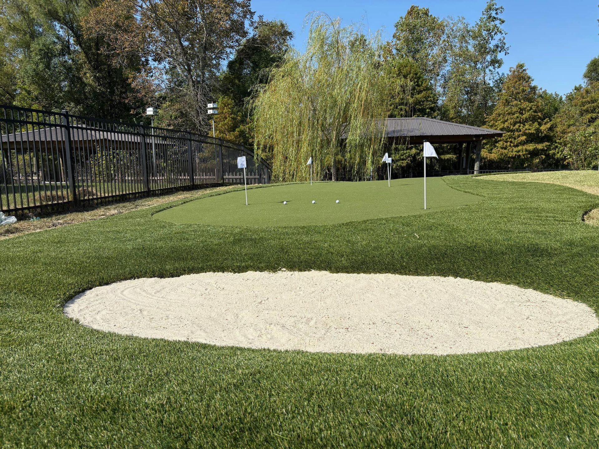 A golf course with a bunker in the middle of it.