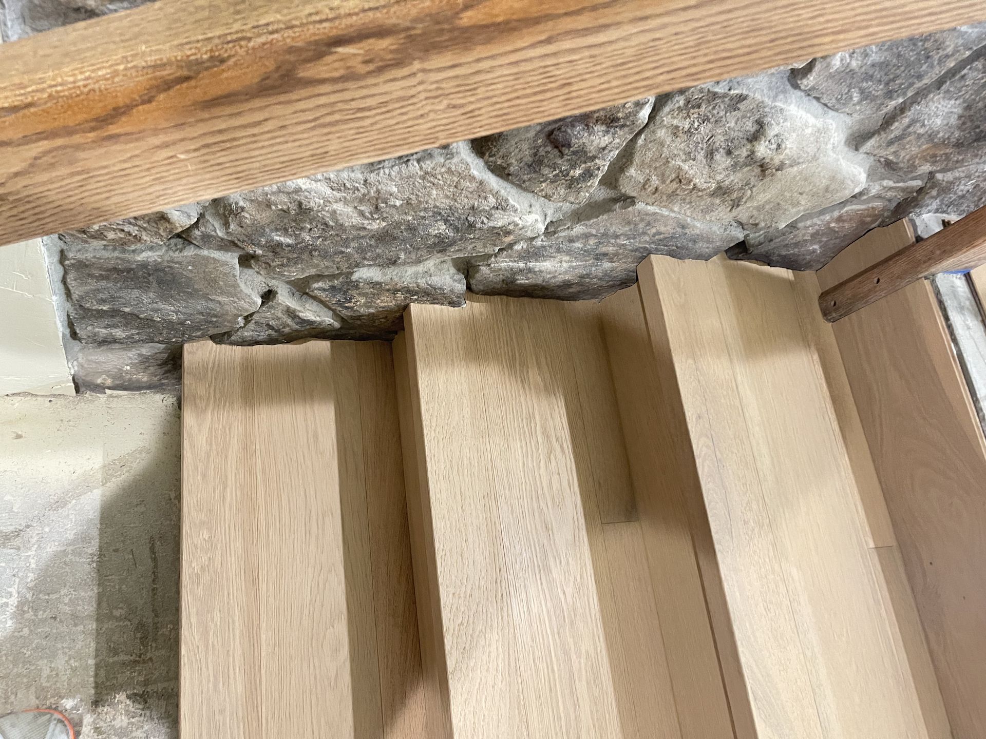 Hardwood flooring material and stair installation in Seattle