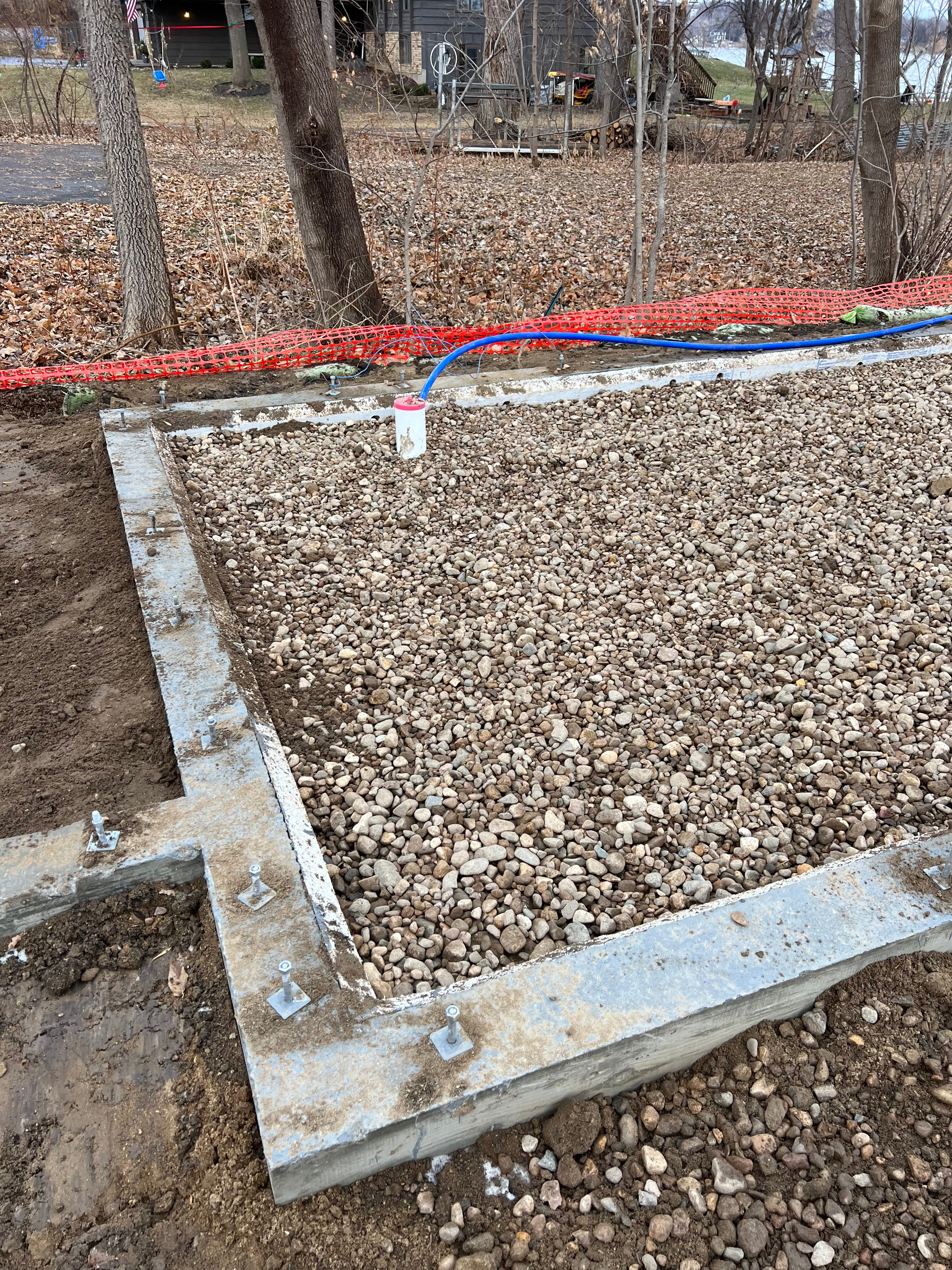 A concrete block is sitting on top of a pile of gravel.