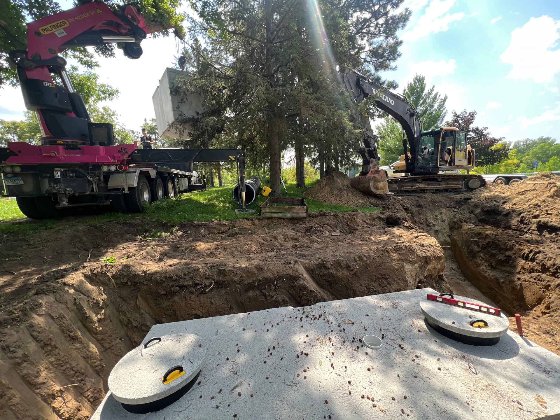 A large excavator is digging a hole in the ground.