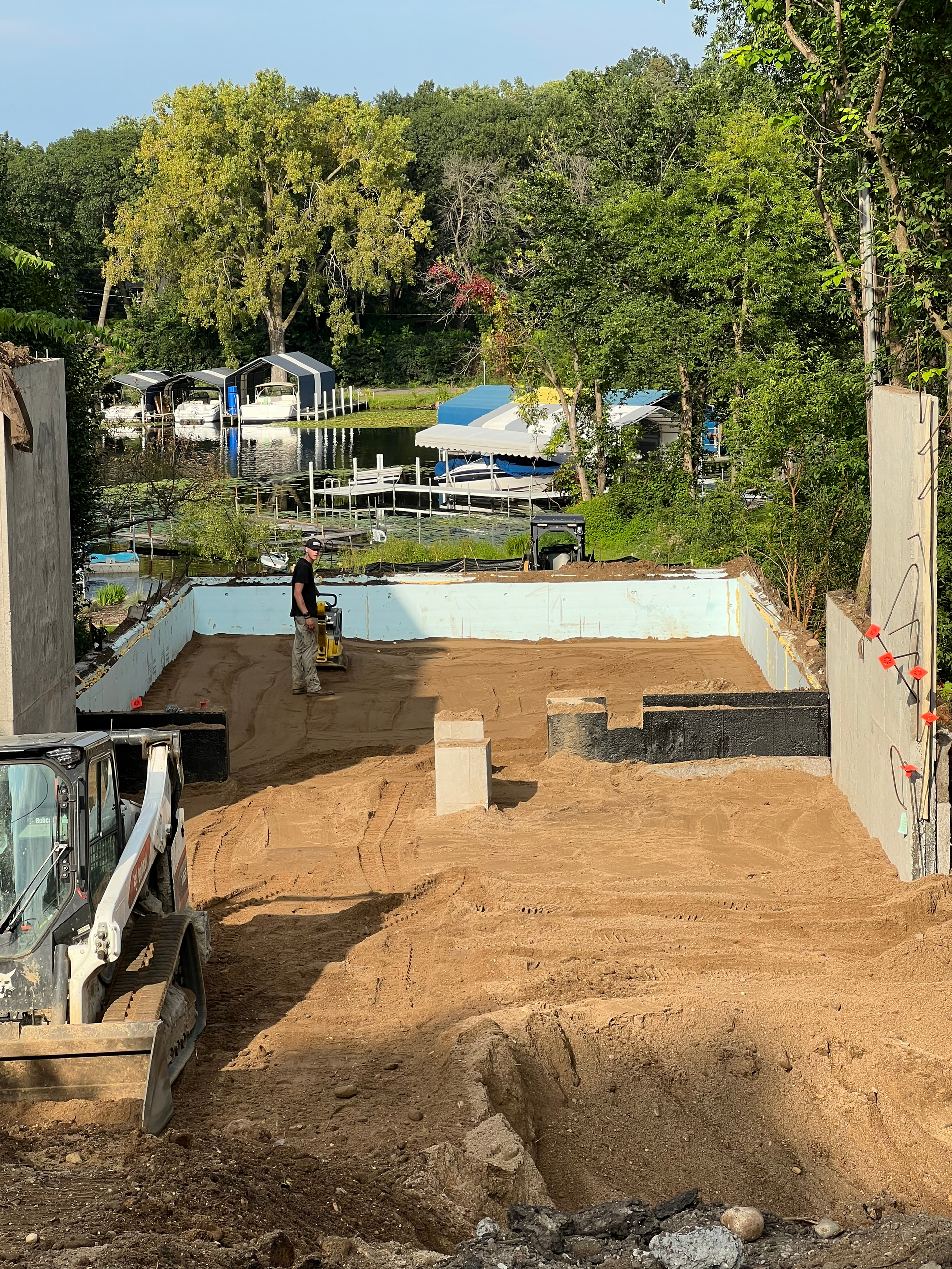 A bulldozer is moving dirt on a construction site.