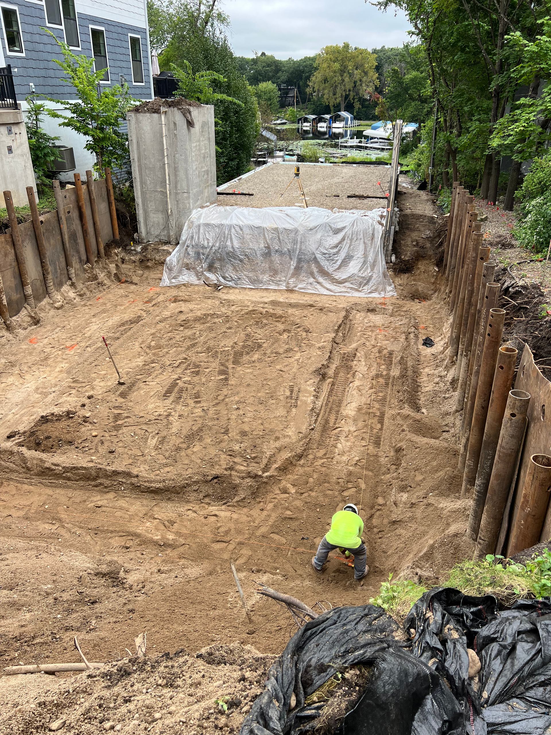 A man is digging in the dirt in a construction site.