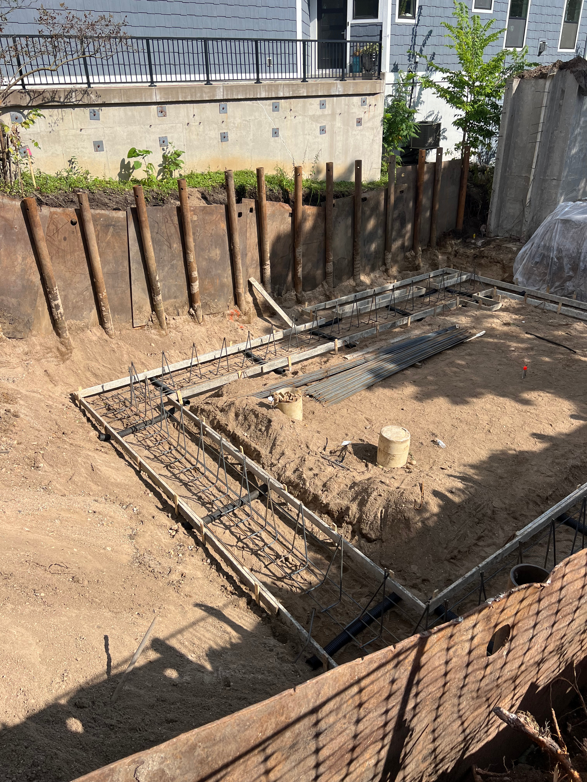 A construction site with a lot of concrete and metal.