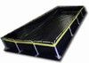 Rectangular black solar panel on a support frame, possibly for heating water.