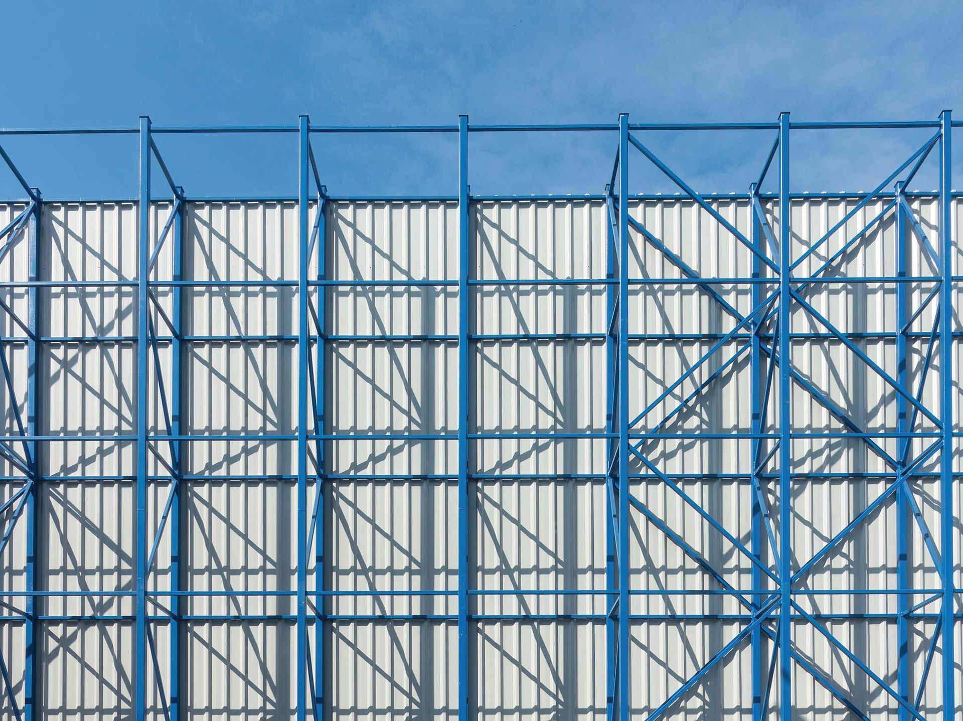 Commercial industrial canvas structure with blue steel framework.