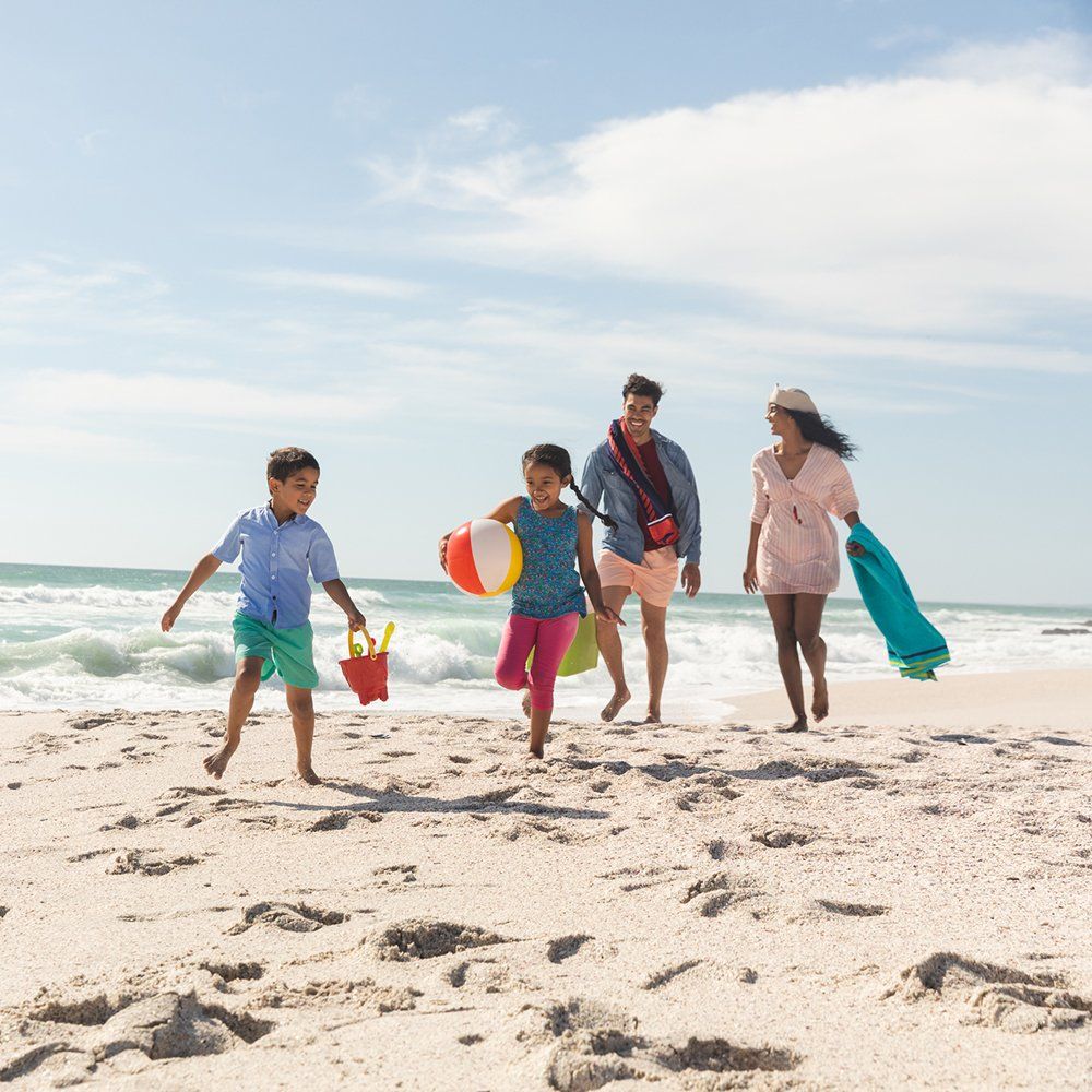 Family At Beach — Lake Worth, FL — Mercer Law Immigration Attorneys