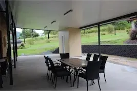 Table And Chairs On Patio Area - Home & Renovation Builders In Palm Grove, QLD