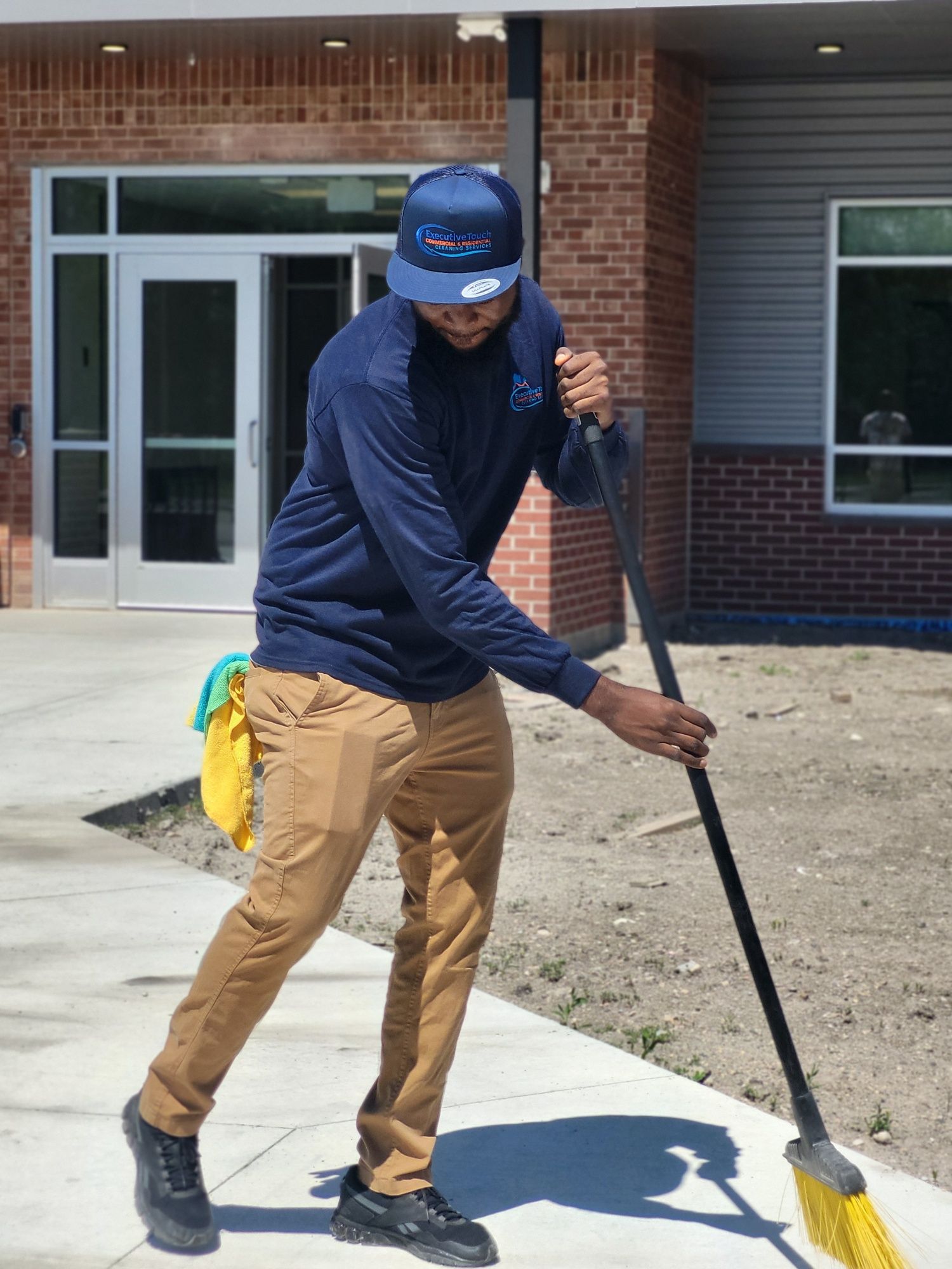 A woman is vacuuming a carpet in a living room.