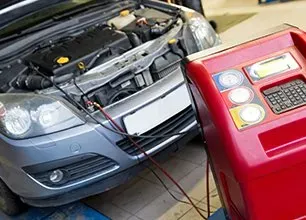Automotive heating and air conditioning image showing technician testing AC unit