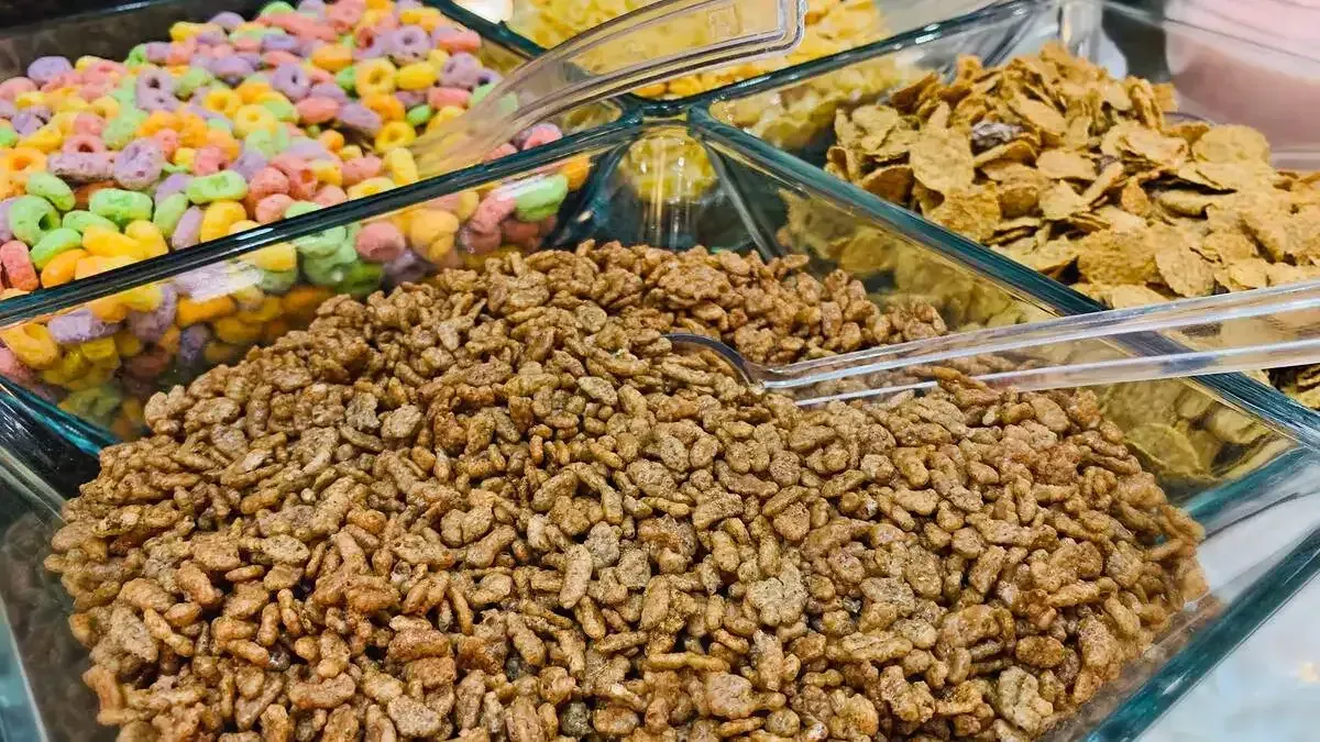 There are many different types of cereal in the bowls.