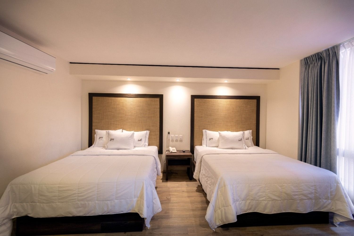 A hotel room with a bed and a coffee maker.