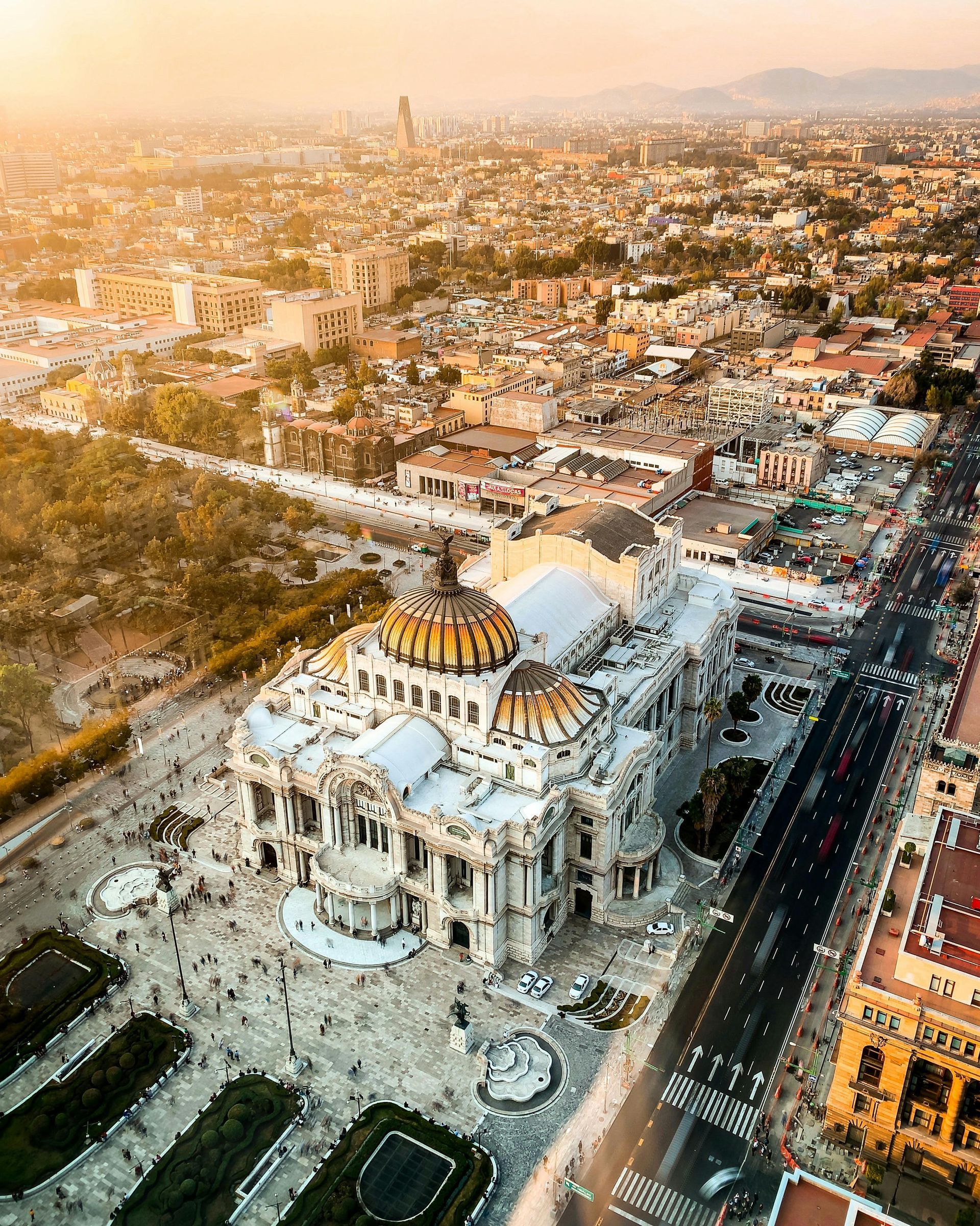 An aerial view of a large building in the middle of a city.