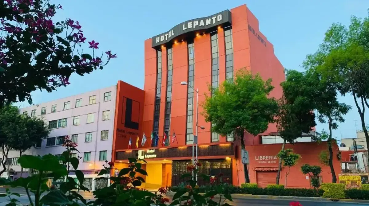A large red building with the word hotel on it