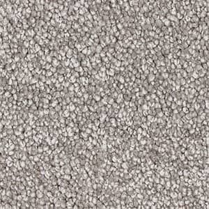 A close up of a gray carpet texture.