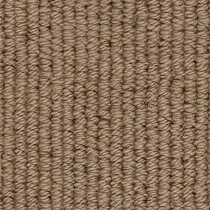 A close up of a brown carpet texture.