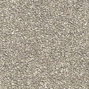 A close up of a carpet with a lot of small stones on it.