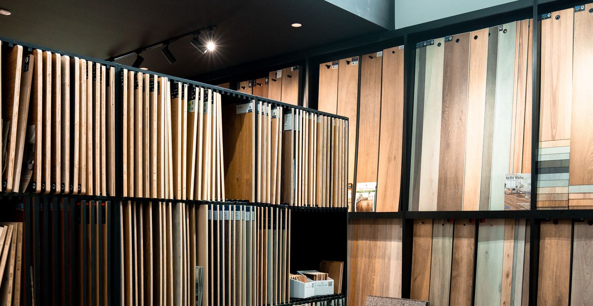 A bedroom with a bed , nightstand , and window.