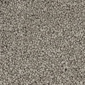 A close up of a pile of gray carpet.
