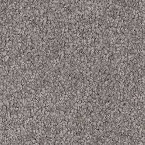 A close up of a gray carpet texture.