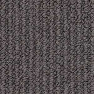 A close up of a gray carpet texture.