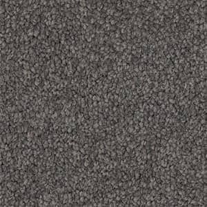 A close up of a gray carpet texture.
