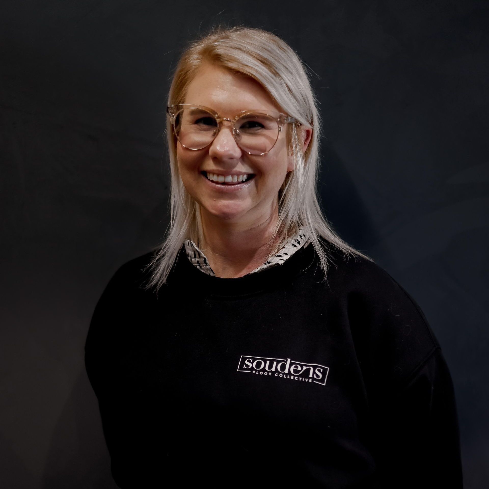 A man with a beard wearing a black t-shirt that says ' astrid ' on it