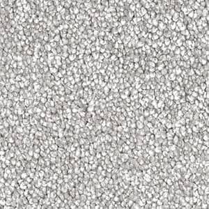 A close up of a pile of silver beads.