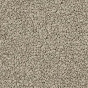 A close up of a carpet with a lot of small dots on it.