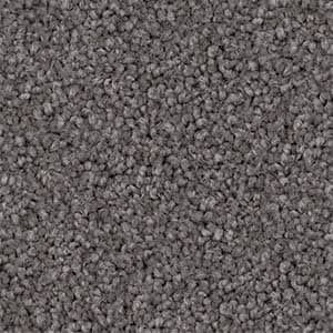 A close up of a gray carpet texture.