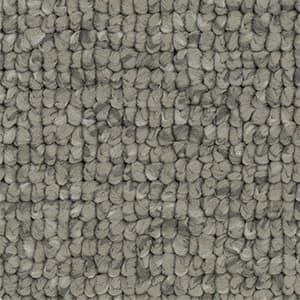 A close up of a gray carpet with a knitted pattern.