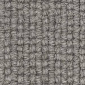 A close up of a gray carpet texture.