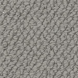 A close up of a gray carpet texture.