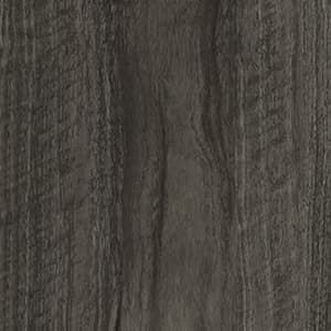 A close up of a gray wood grain texture.