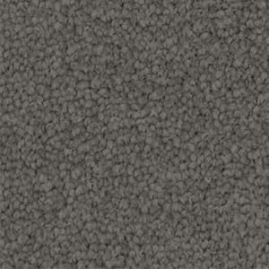 A close up of a gray carpet texture.