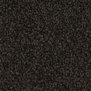 A close up of a black carpet texture.