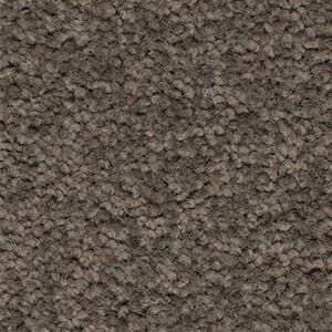 A close up of a brown carpet texture.