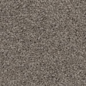 A close up of a carpet with a lot of small stones on it.