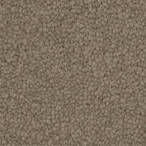 A close up of a brown carpet texture.