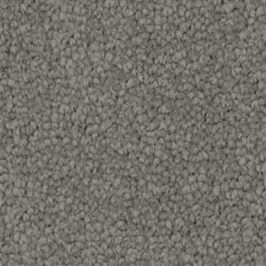 A close up of a gray carpet texture.