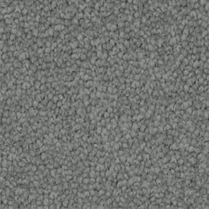 A close up of a gray carpet texture.