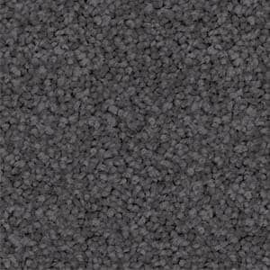 A close up of a gray carpet texture.