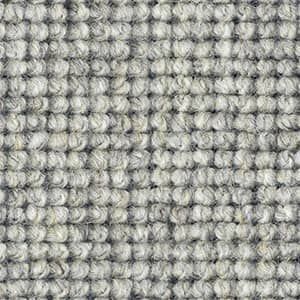 A close up of a carpet with a pattern on it.