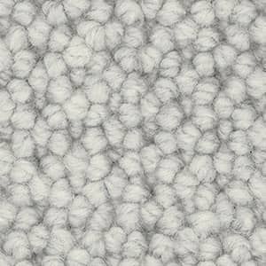 A close up of a white carpet texture.