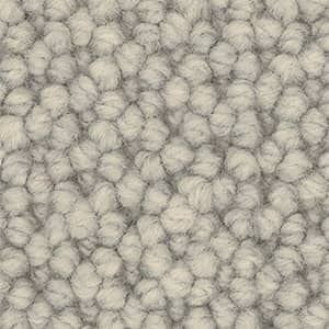 A close up of a white carpet texture.