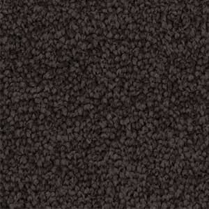 A close up of a brown carpet texture.