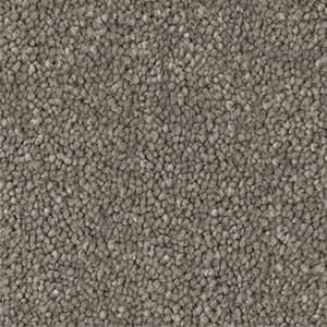 A close up of a carpet with a lot of small dots on it.