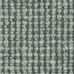 A close up of a gray carpet with a striped pattern.