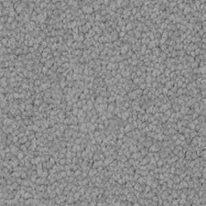 A close up of a gray carpet texture.